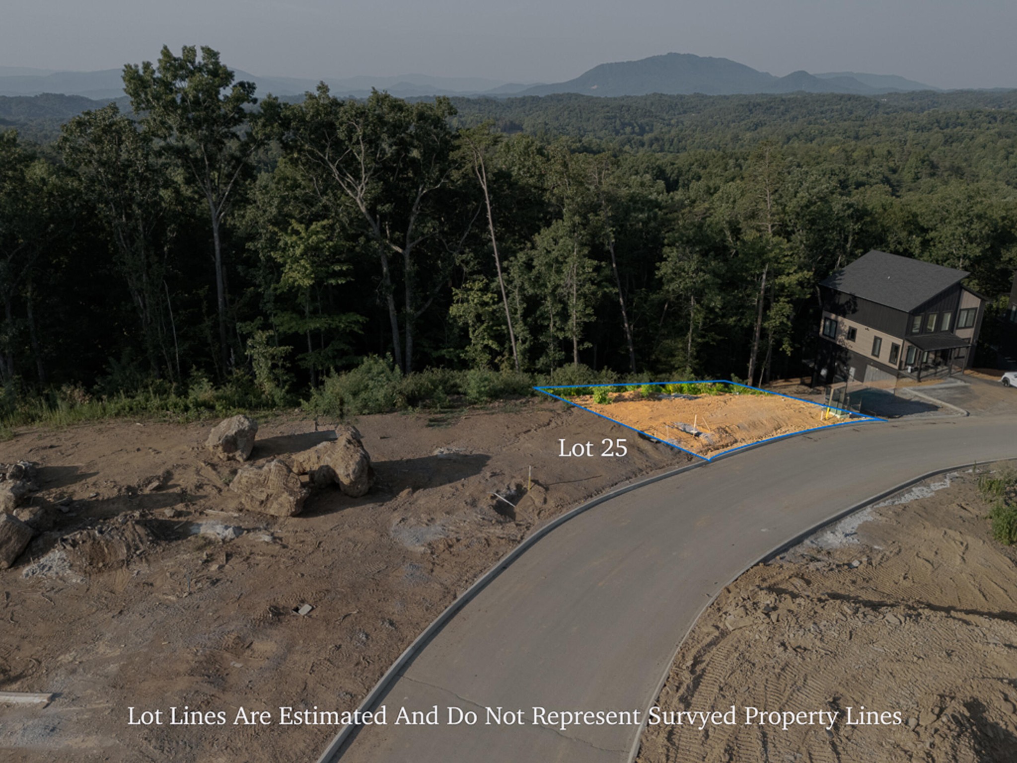 25 Reedmont Way Sevierville, TN 37876 - Photo 1 of 14 a view of a road with a bench in the background