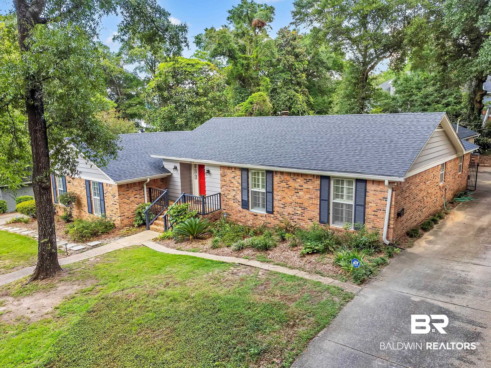 309 West Brandy Run Road Mobile, AL 36608 - Photo 94 of 100 Single story home featuring a shingled roof, brick siding, and a front lawn