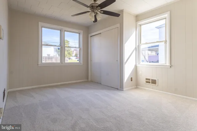 a bathroom with a toilet a sink a bathtub and a window