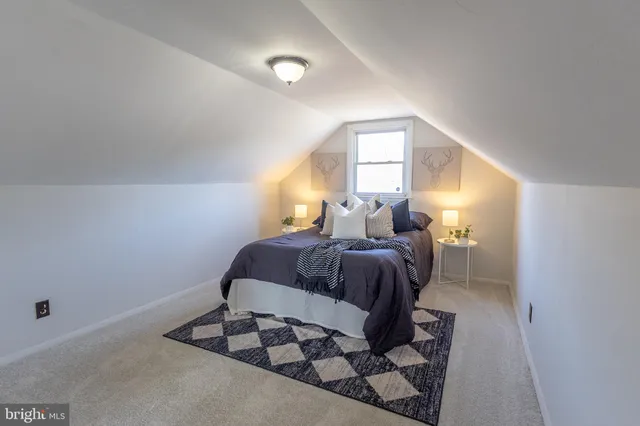 a view of a house with swimming pool and sitting area
