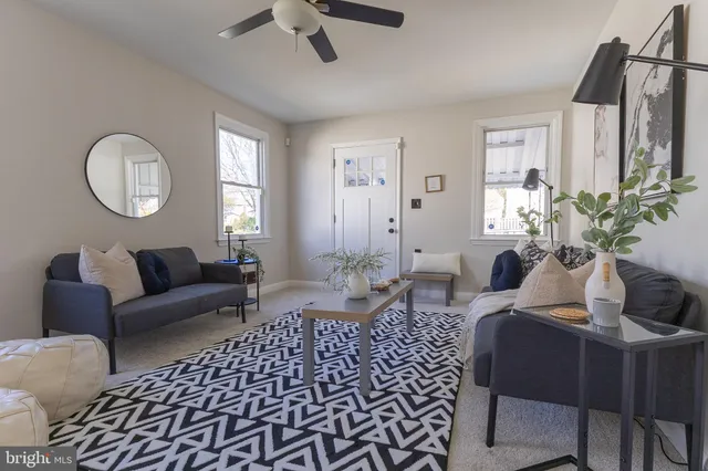 a kitchen with stainless steel appliances granite countertop wooden cabinets a refrigerator and a window