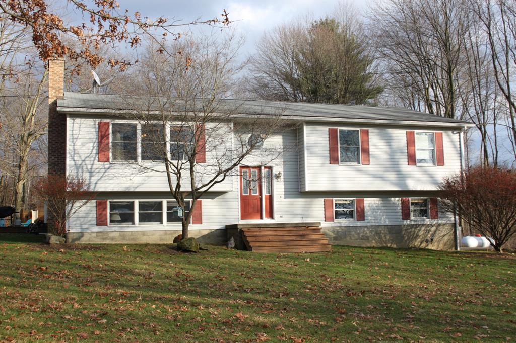 1216 Raymilton Road Polk, PA 16342 - Photo 1 of 1 a front view of a house with a garden