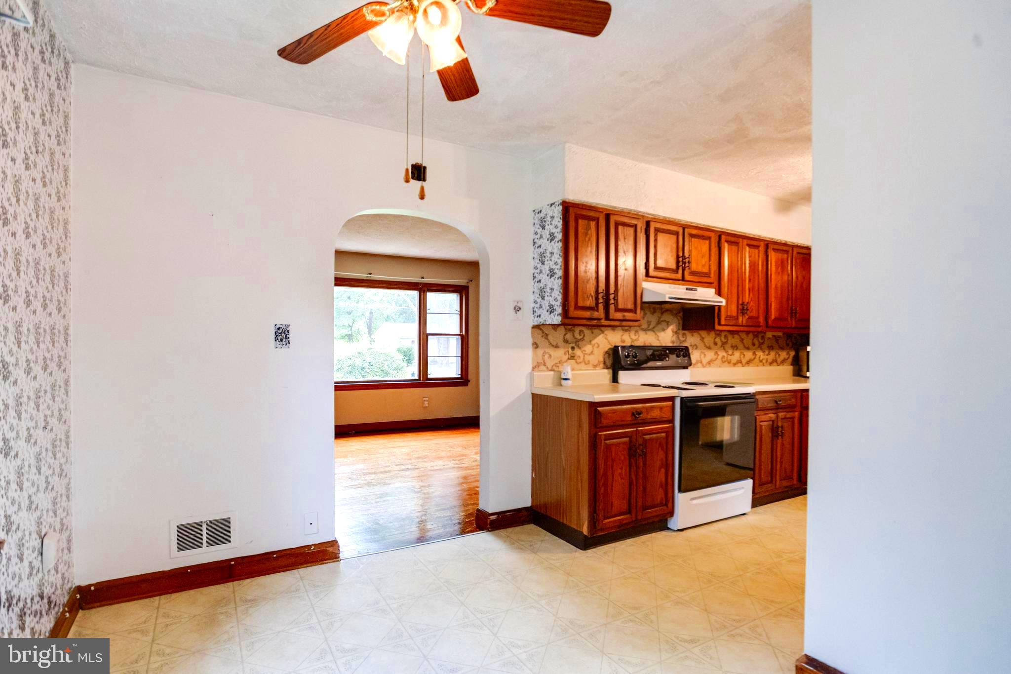 1405 Pomeroy Avenue Abingdon, MD 21009 - Photo 14 of 60 a kitchen with stainless steel appliances granite countertop a stove and a refrigerator