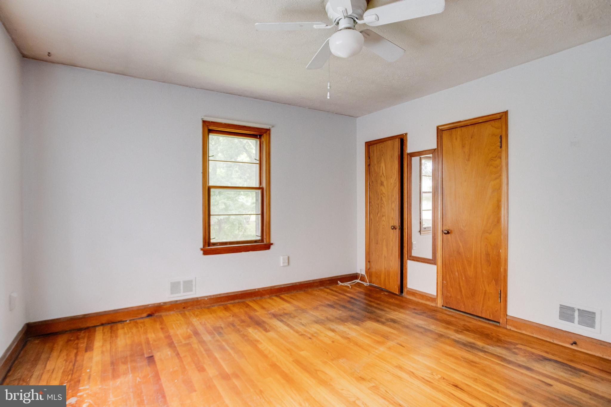 1405 Pomeroy Avenue Abingdon, MD 21009 - Photo 21 of 60 a view of an empty room with wooden floor and a window