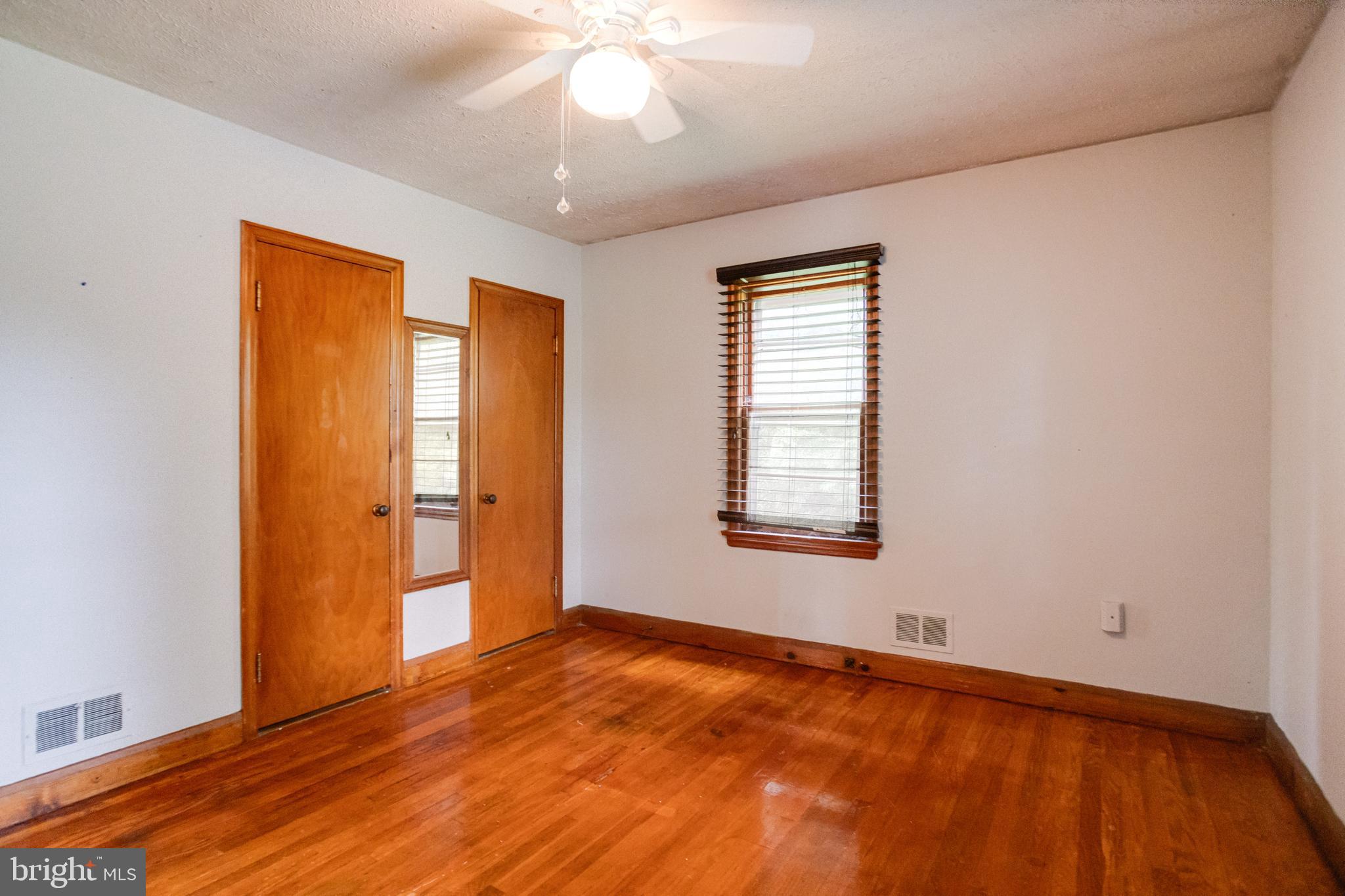 1405 Pomeroy Avenue Abingdon, MD 21009 - Photo 24 of 60 a view of an empty room with wooden floor and a window