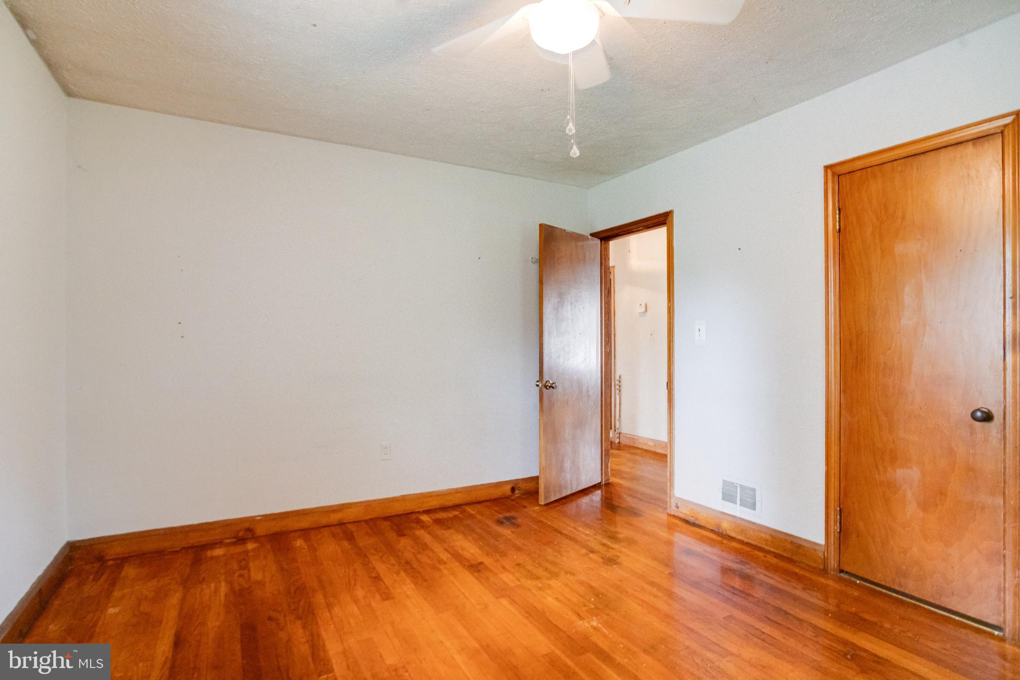 1405 Pomeroy Avenue Abingdon, MD 21009 - Photo 25 of 60 a view of an empty room with wooden floor and a window