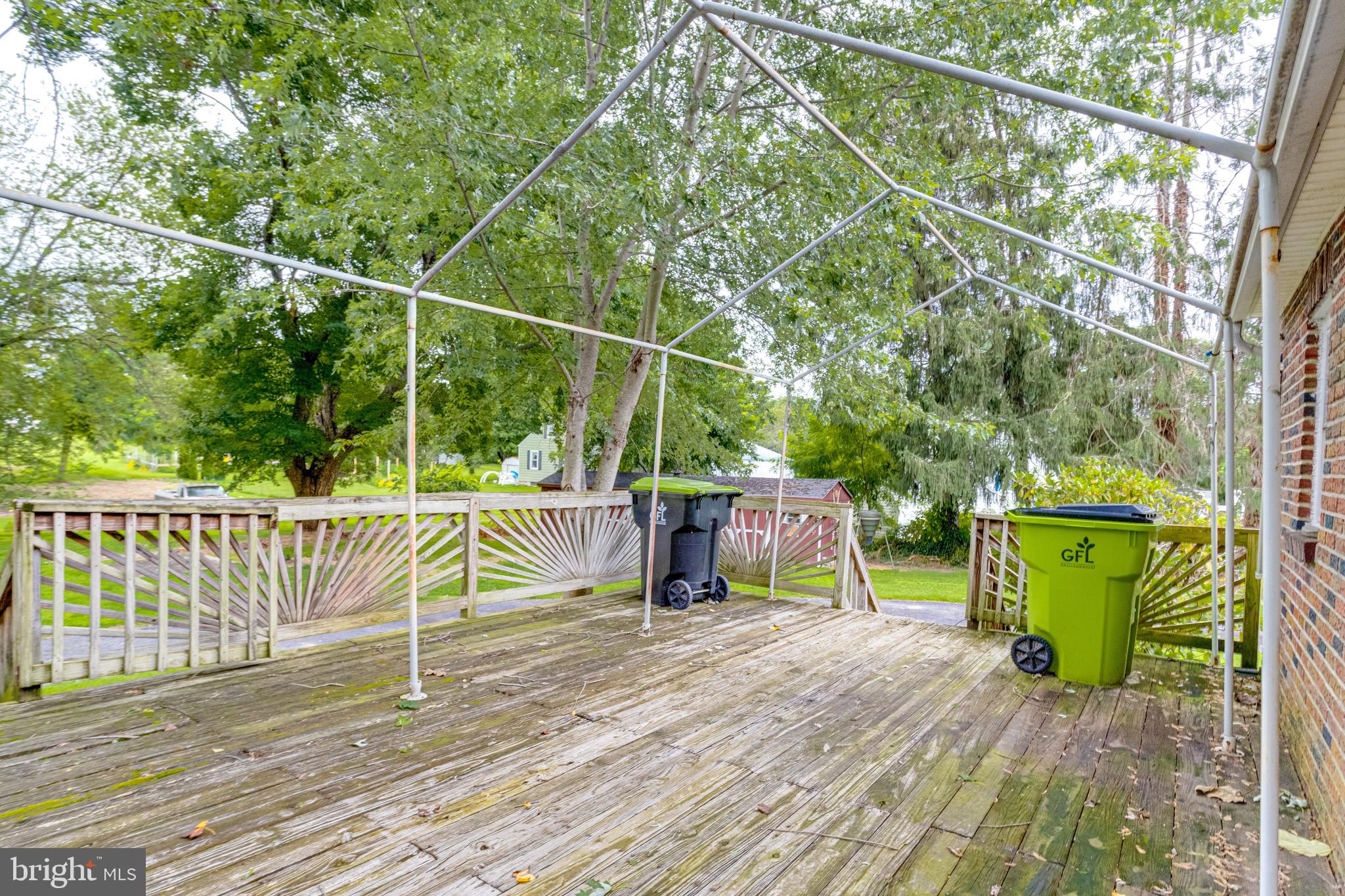 1405 Pomeroy Avenue Abingdon, MD 21009 - Photo 40 of 60 a view of a deck with a chair and wooden floor