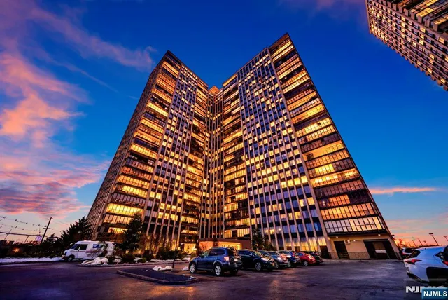 a living room with furniture a rug and a flat screen tv