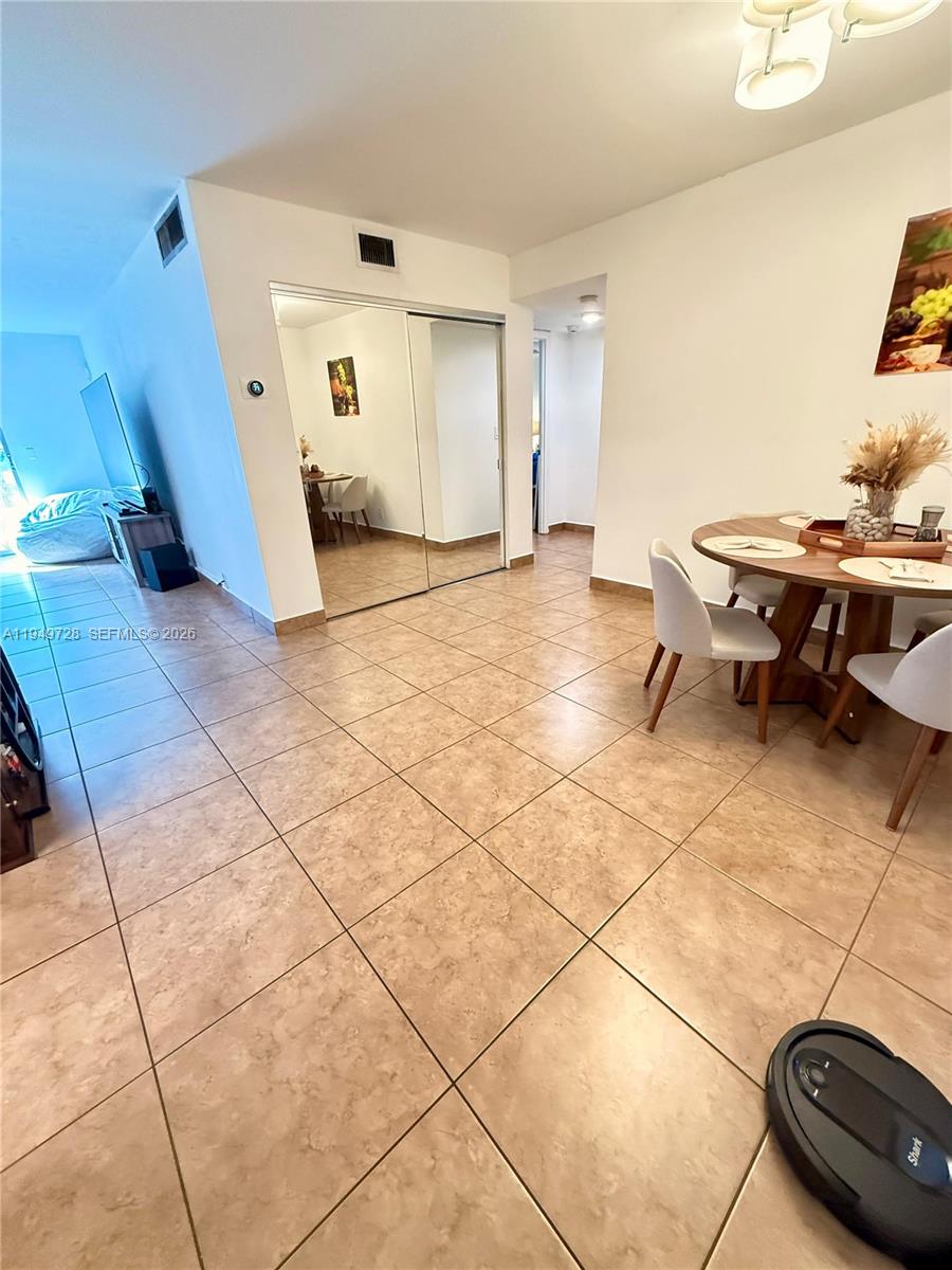 5790 Stirling Road, Unit 104 Hollywood, FL 33021 - Photo 13 of 19 a view of a hallway with seating area