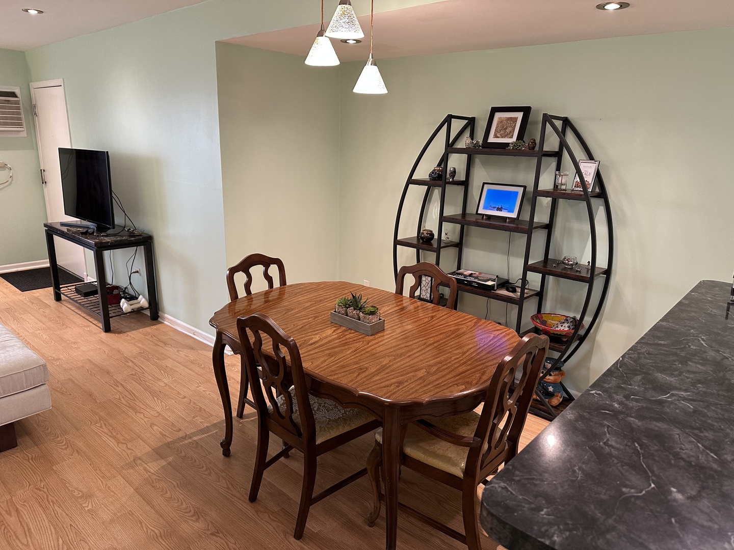 5155 North East River Road, Unit 116E Chicago, IL 60656 - Photo 3 of 10 a view of a dining room with furniture and a chandelier