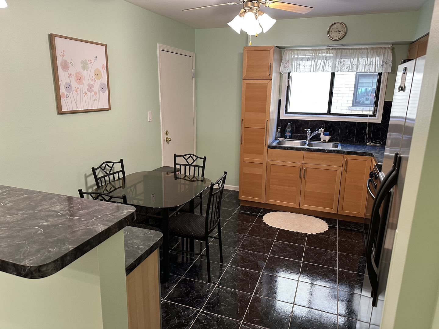 5155 North East River Road, Unit 116E Chicago, IL 60656 - Photo 5 of 10 a view of a dining room with furniture and window