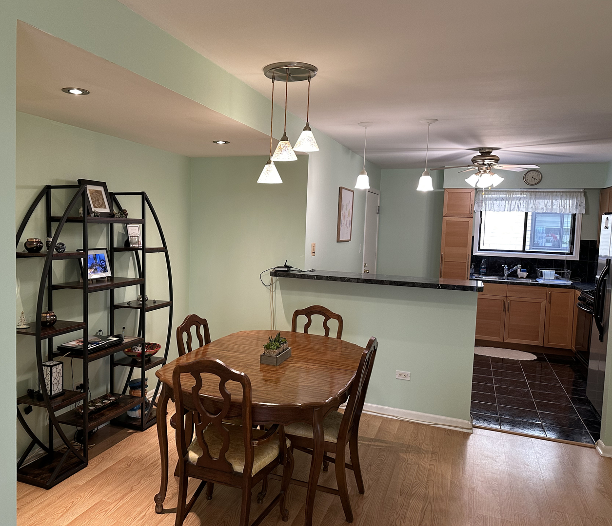 5155 North East River Road, Unit 116E Chicago, IL 60656 - Photo 8 of 10 a view of a dining room with furniture and wooden floor