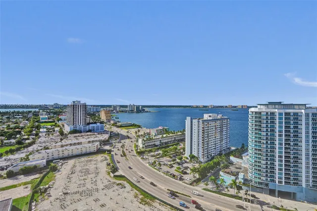 a view of a room with window and wooden floor