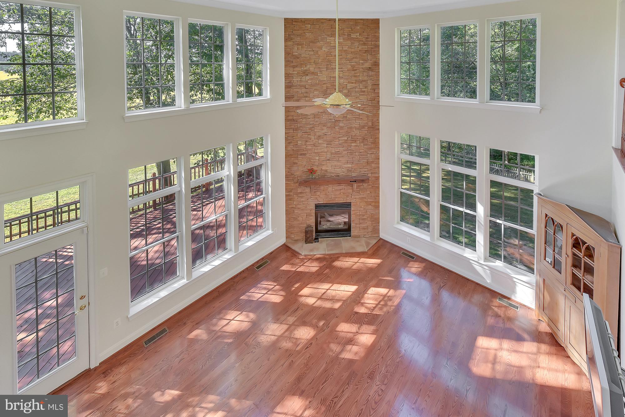 21416 Peach Tree Road Dickerson, MD 20842 - Photo 27 of 76 Floor to ceiling brick fireplace