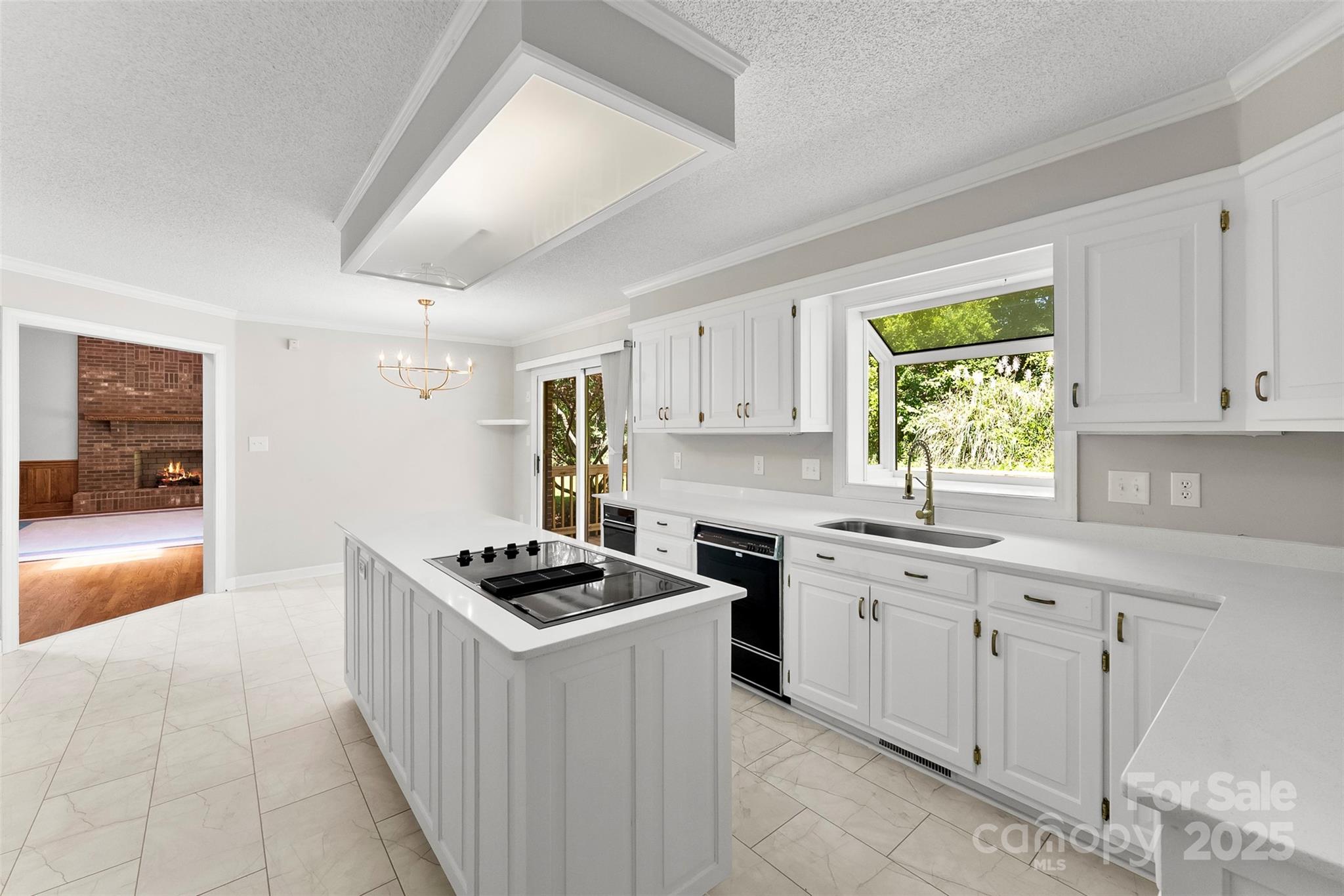 1505 North Cansler Street Kings Mountain, NC 28086 - Photo 11 of 46 a kitchen with cabinets appliances and a window