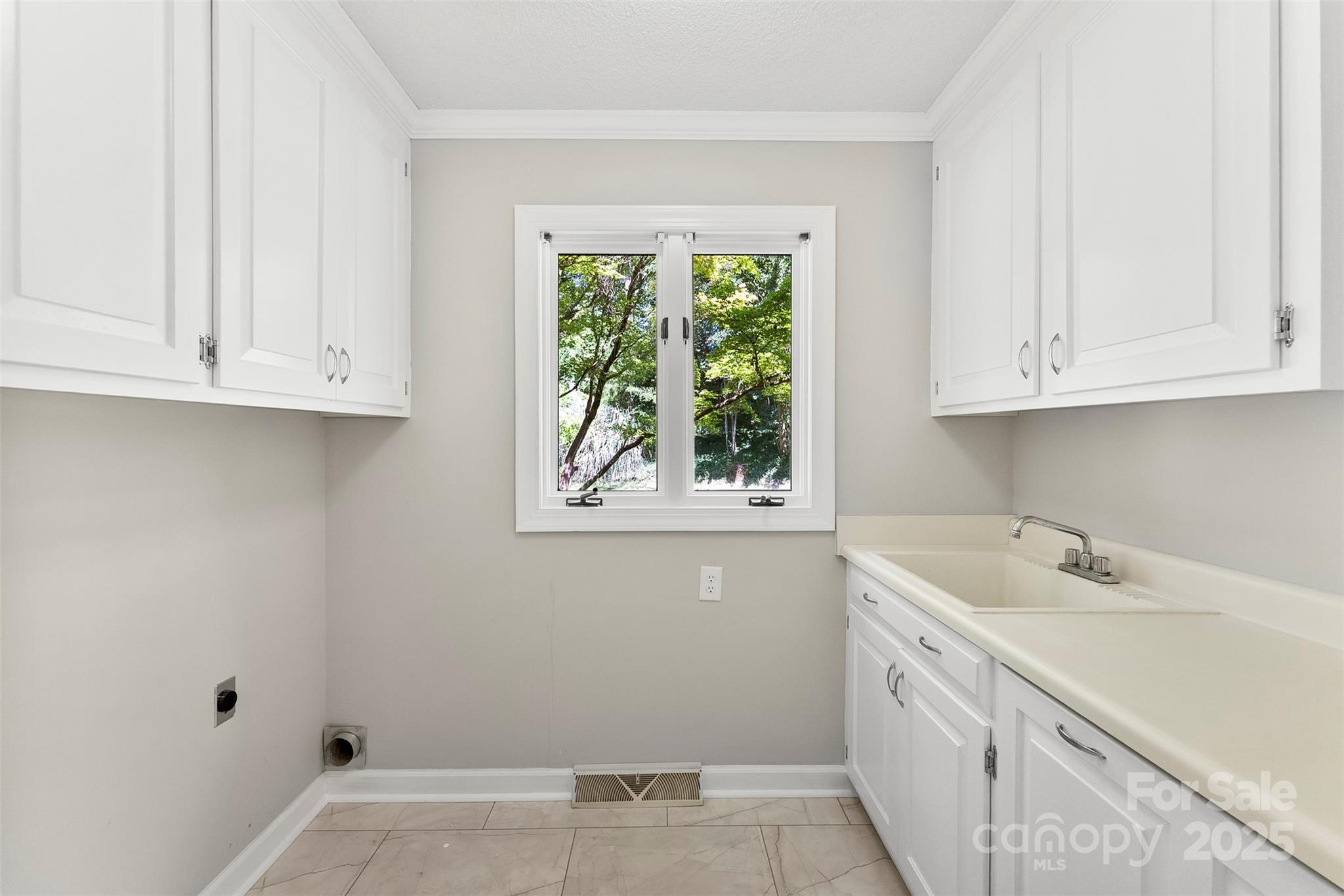 1505 North Cansler Street Kings Mountain, NC 28086 - Photo 13 of 46 a view of cabinets with window