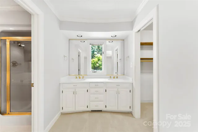 a spacious bathroom with a granite countertop sink and a mirror