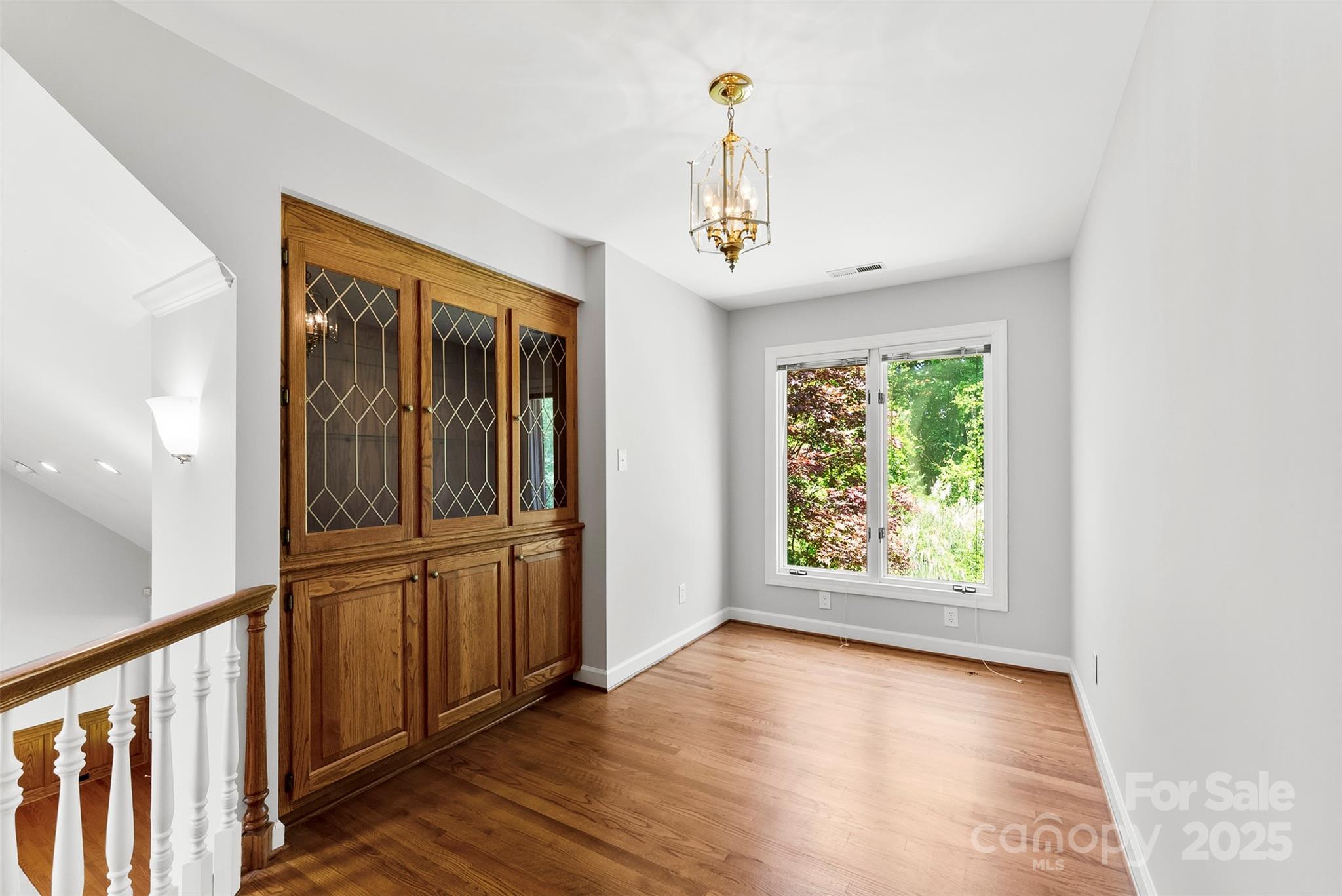 1505 North Cansler Street Kings Mountain, NC 28086 - Photo 24 of 46 wooden floor in an empty room with a window