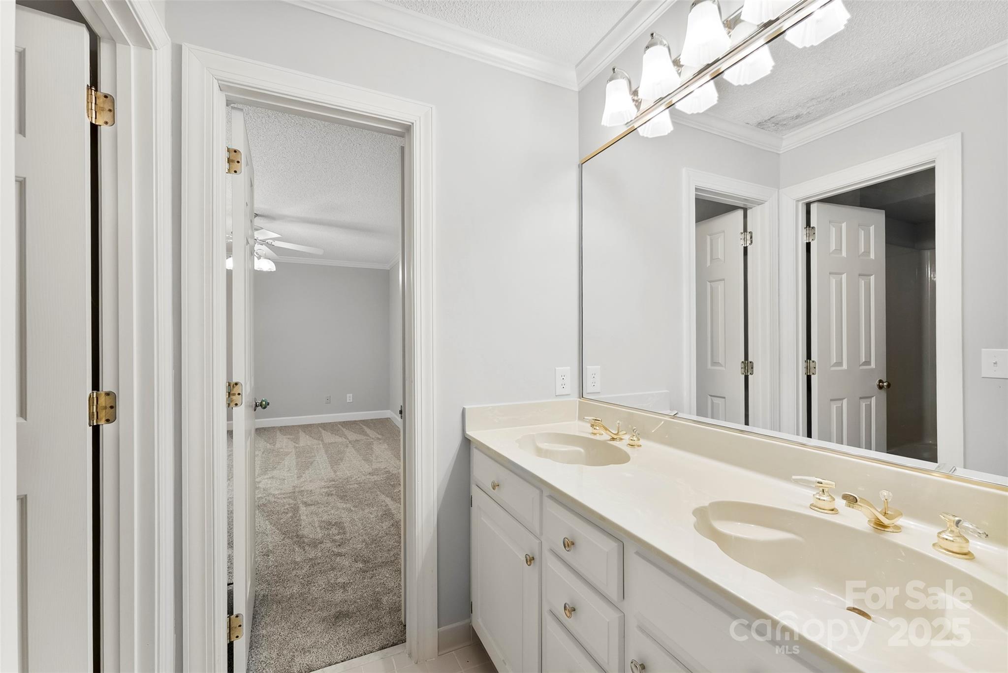 1505 North Cansler Street Kings Mountain, NC 28086 - Photo 28 of 46 a bathroom with a double vanity sink and a mirror