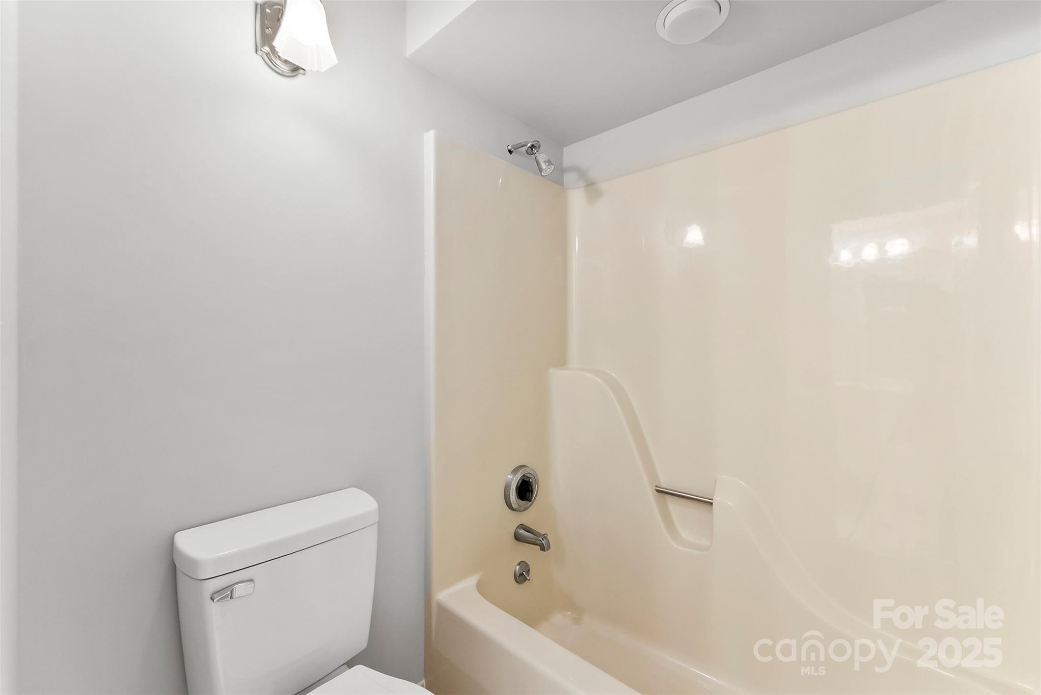 1505 North Cansler Street Kings Mountain, NC 28086 - Photo 29 of 46 a bathroom with a bathtub a toilet and a shower