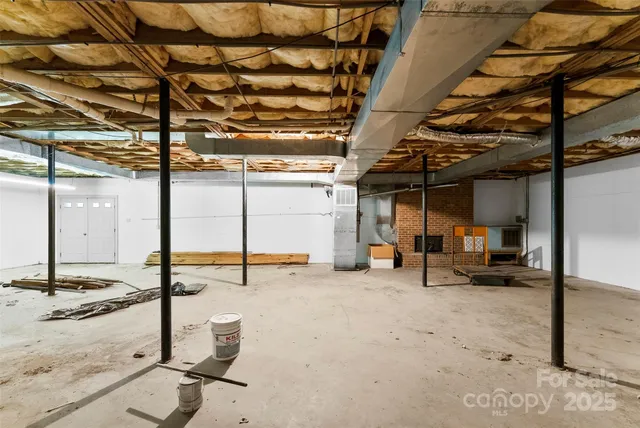 a view of a backyard with seating space