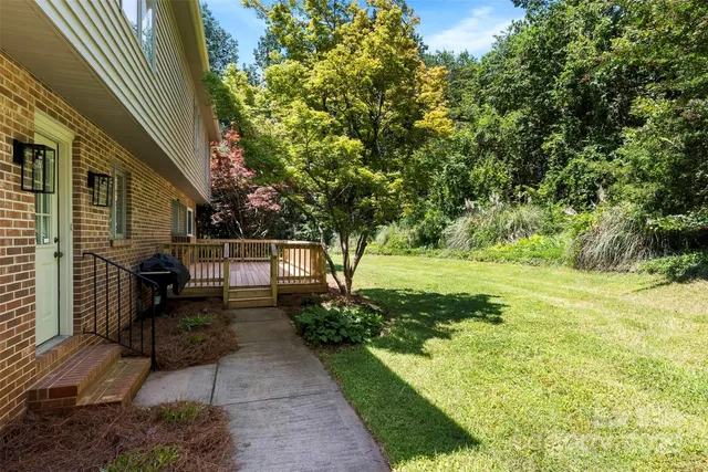 a view of a backyard with sitting area