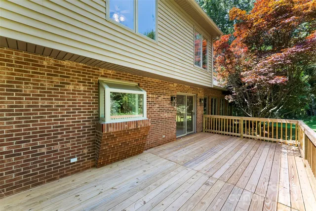 a view of backyard with a deck