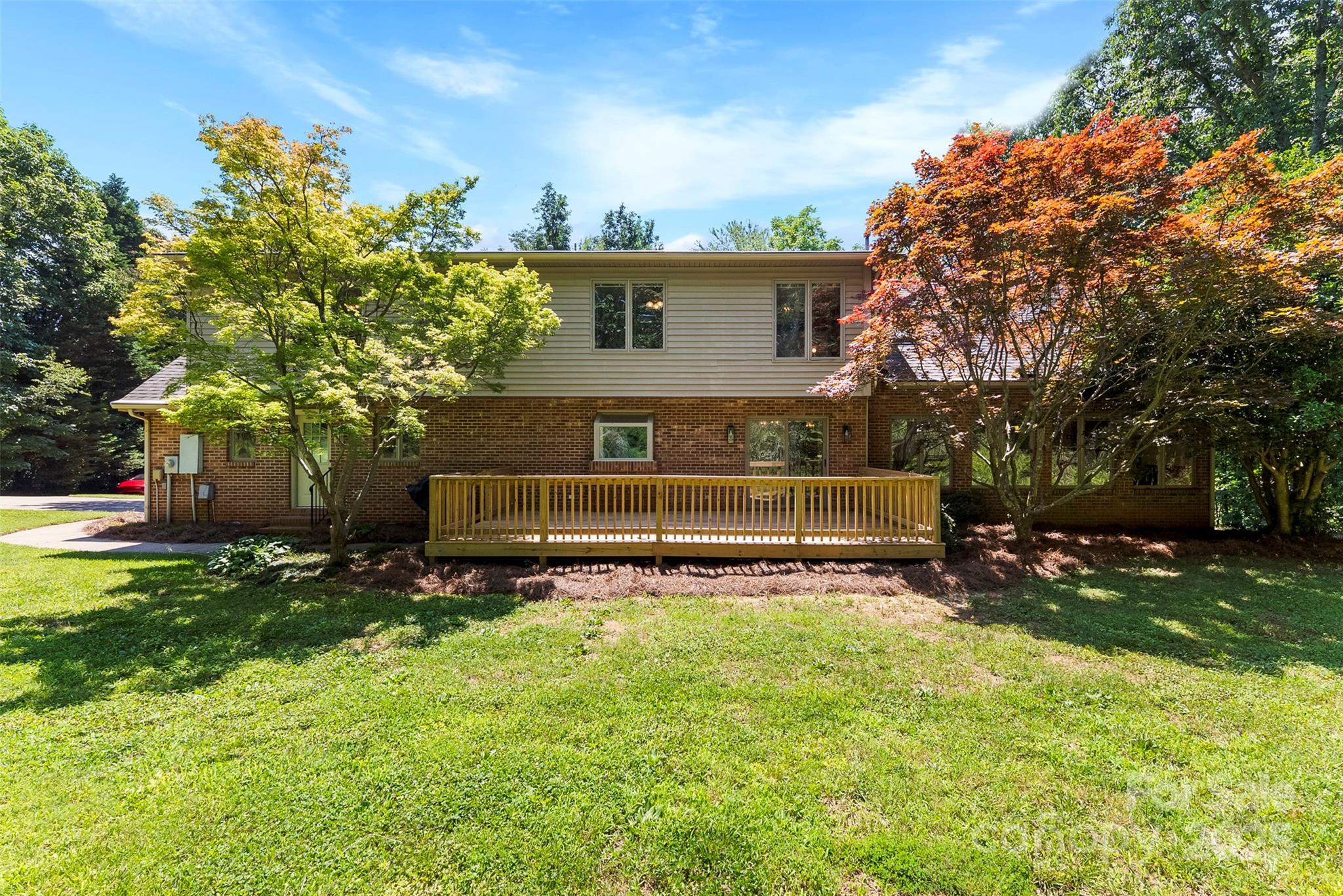 1505 North Cansler Street Kings Mountain, NC 28086 - Photo 41 of 46 a view of a house with a big yard and large trees