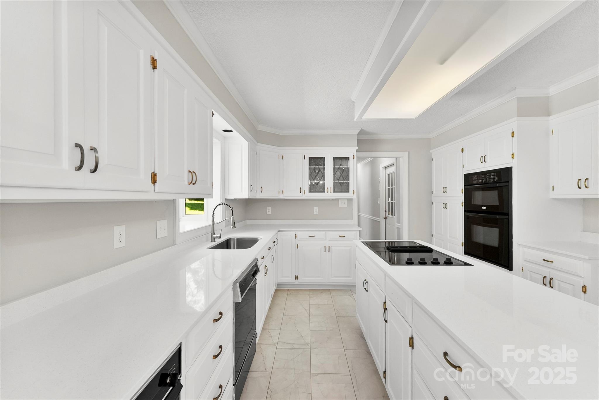 1505 North Cansler Street Kings Mountain, NC 28086 - Photo 9 of 46 a kitchen with a sink a stove and cabinets