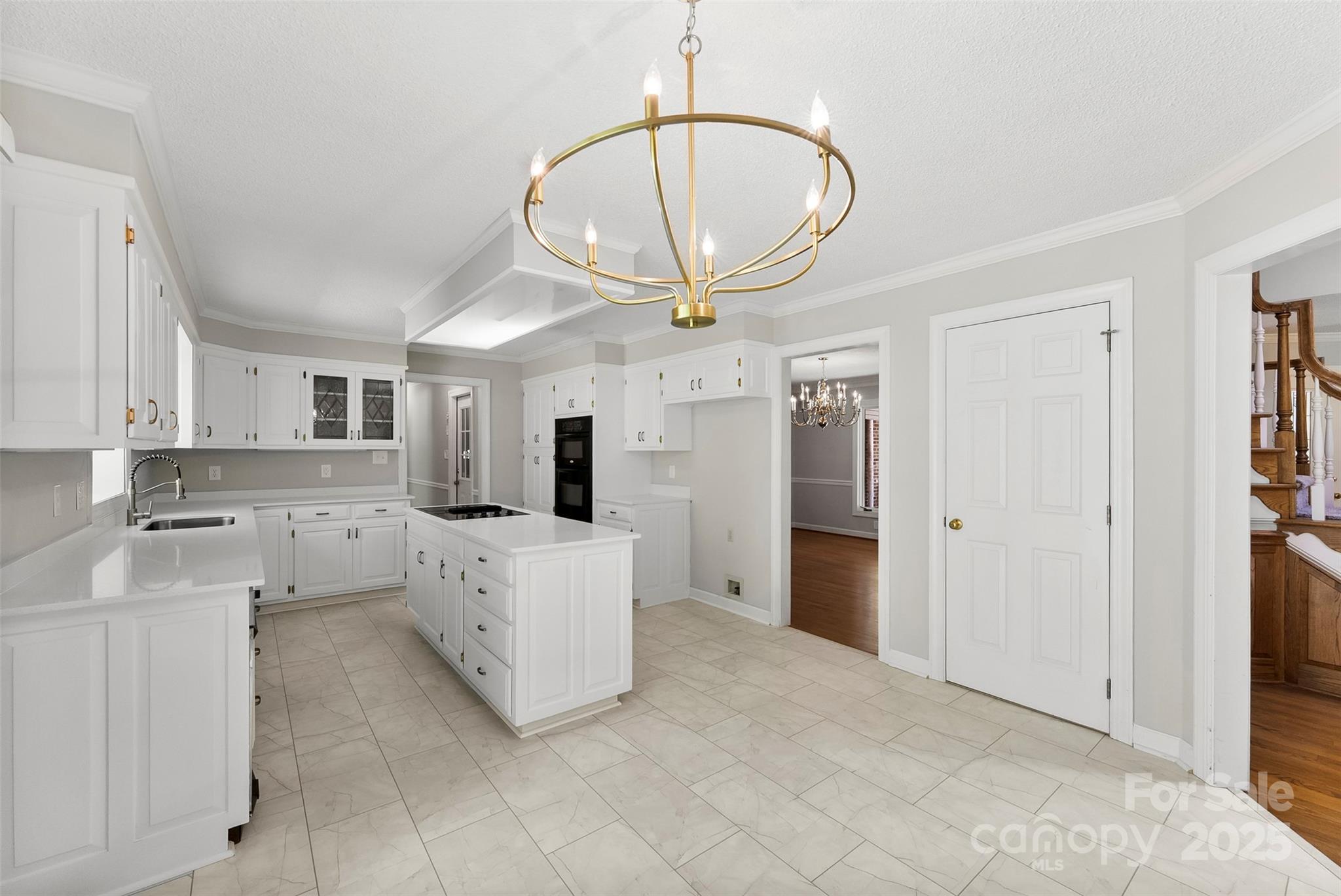 1505 North Cansler Street Kings Mountain, NC 28086 - Photo 10 of 46 a large white kitchen with cabinets