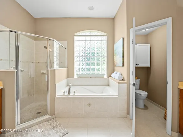 a living room with dining room and wooden floor