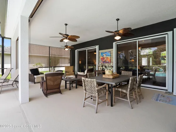 a living room with furniture and a piano
