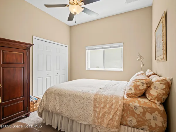 a living room with furniture a rug and a chandelier