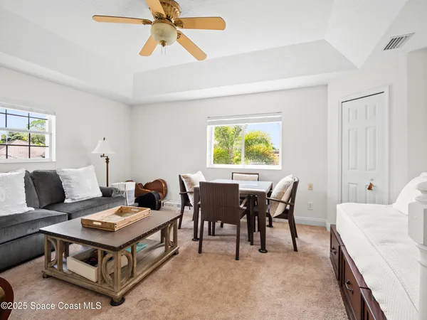 a view of a swimming pool with a patio and a yard