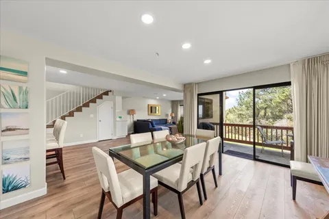a view of a balcony with wooden floor and fence