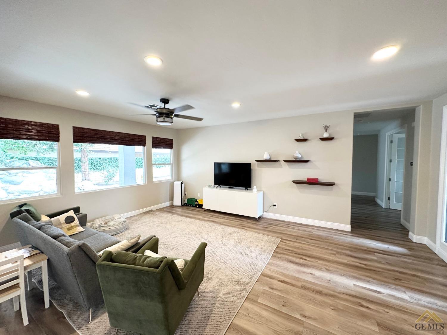Undisclosed Address Bakersfield, CA 93311 - Photo 13 of 30 a living room with furniture and a flat screen tv