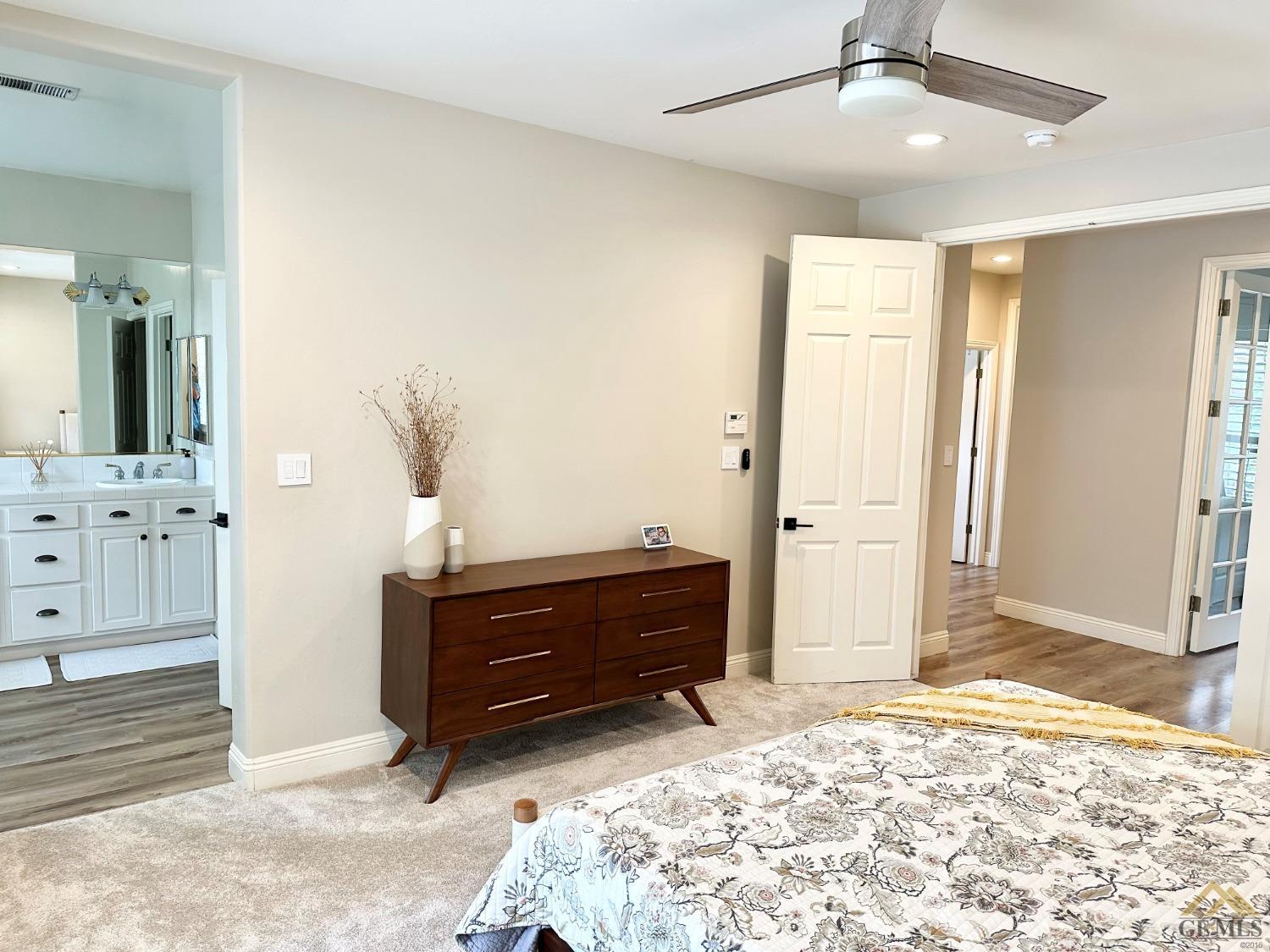 Undisclosed Address Bakersfield, CA 93311 - Photo 19 of 30 a bedroom with a bed and a dresser