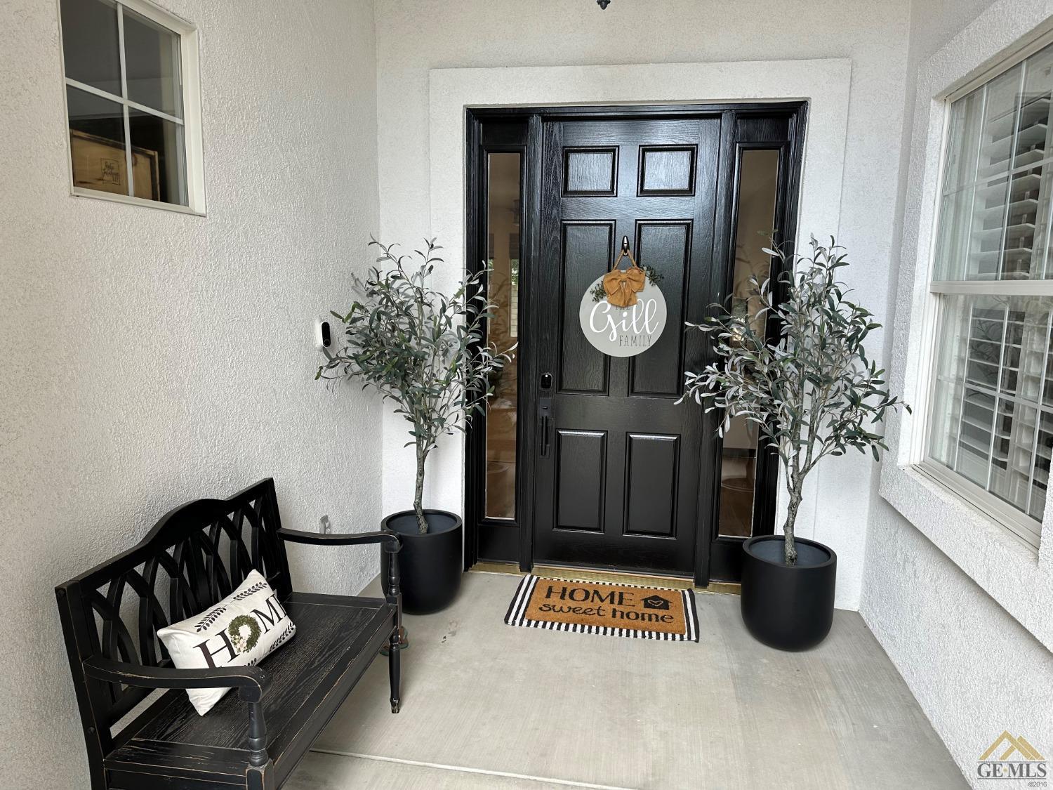 Undisclosed Address Bakersfield, CA 93311 - Photo 3 of 30 a living room with furniture and a potted plant
