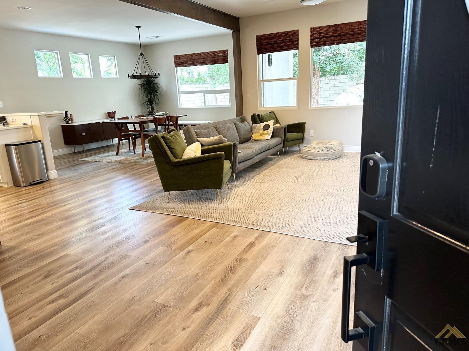 Undisclosed Address Bakersfield, CA 93311 - Photo 4 of 30 a living room with furniture windows and wooden floor