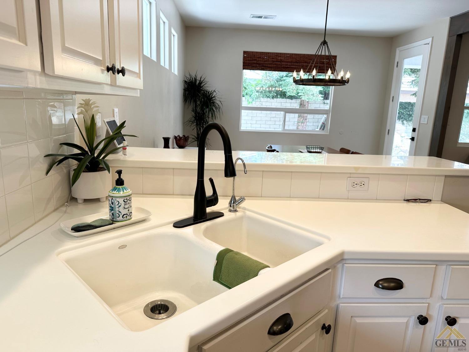Undisclosed Address Bakersfield, CA 93311 - Photo 9 of 30 a bathroom with a tub sink and mirror