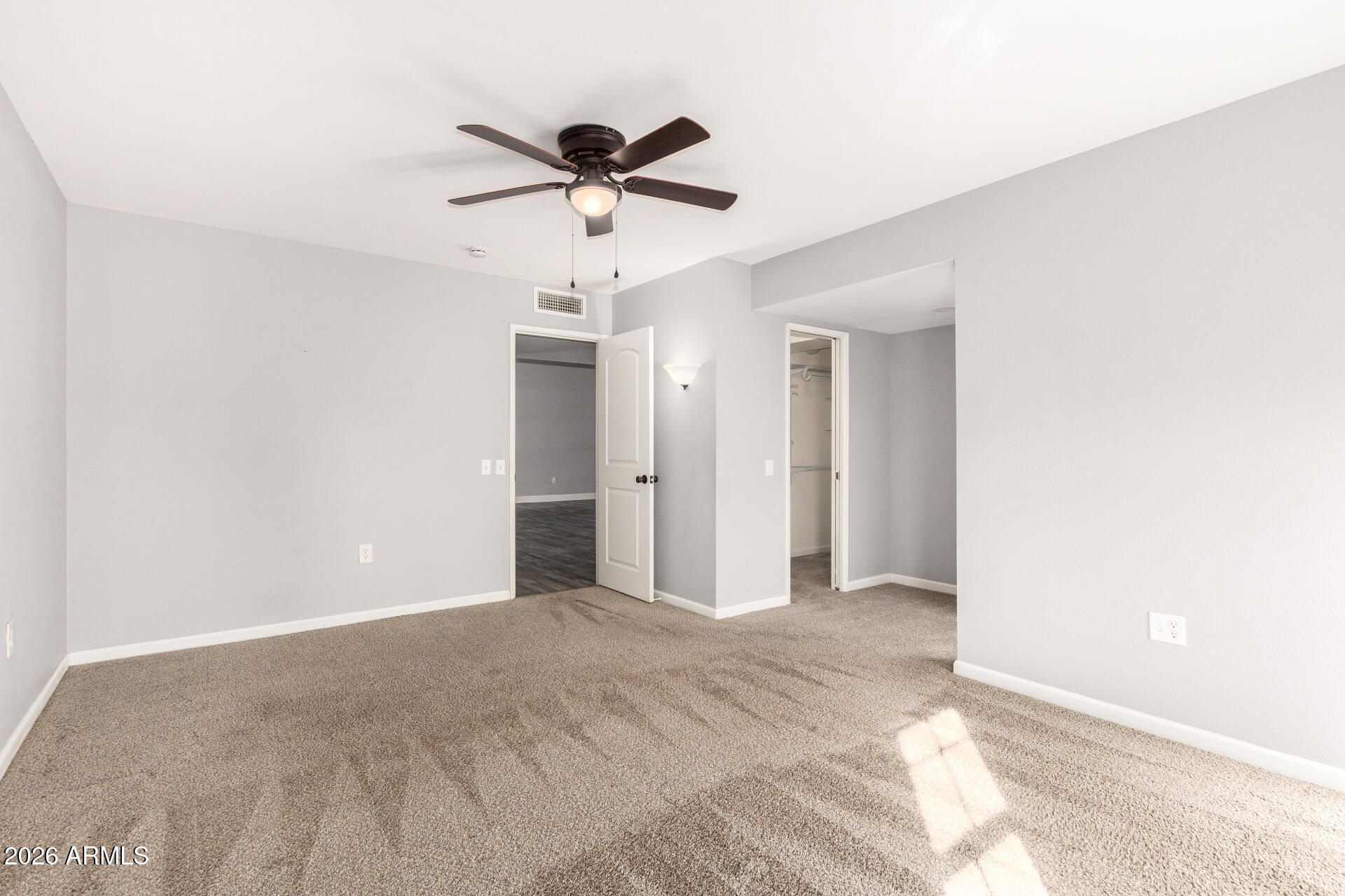 11118 West Mountain View Road Sun City, AZ 85351 - Photo 17 of 34 a view of an empty room and chandelier fan
