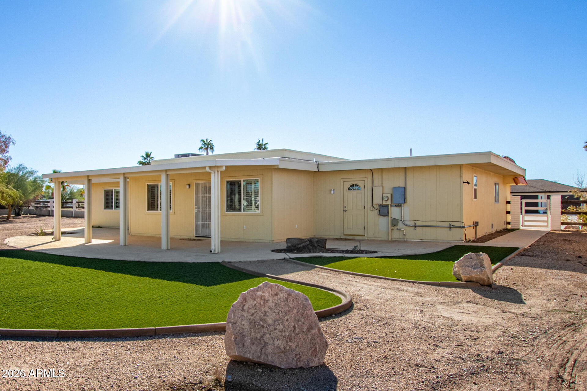 11118 West Mountain View Road Sun City, AZ 85351 - Photo 28 of 34 a front view of a house with a yard and porch