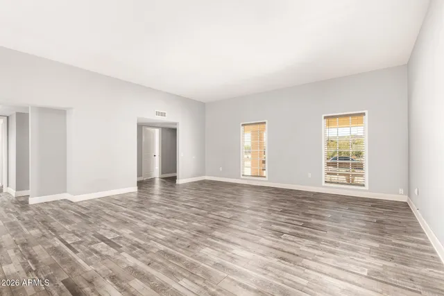 a kitchen with stainless steel appliances granite countertop a refrigerator a stove and a sink