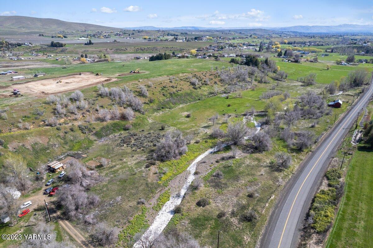 Nka Cook Road, Unit 1 Yakima, WA 98908 - Photo 3 of 10 a view of a lush green hillside and houses