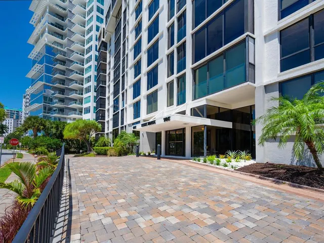a view of a lake with couches and city view