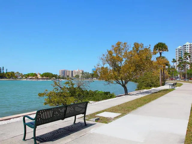 a sign that is sitting in front of flowers