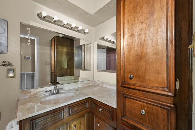 a view of a livingroom with furniture and staircase