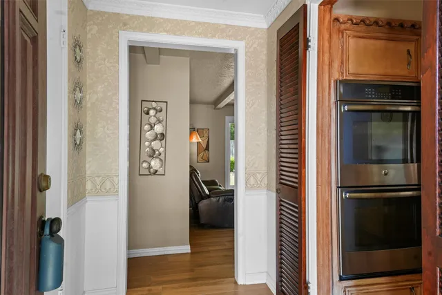 a kitchen with a refrigerator and a stove
