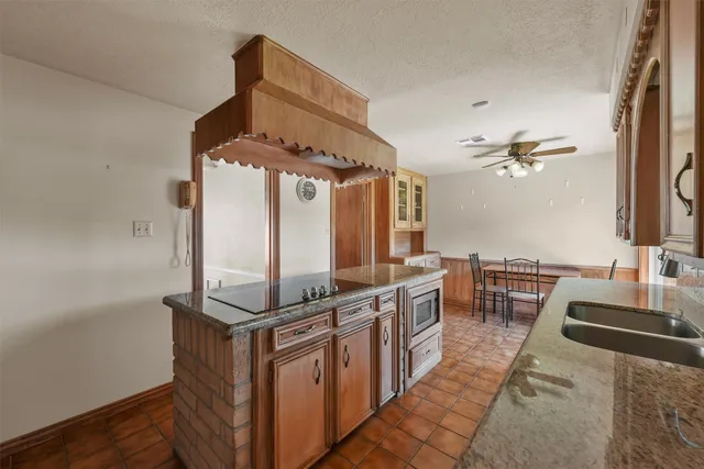 a very nice looking room with many windows and furniture