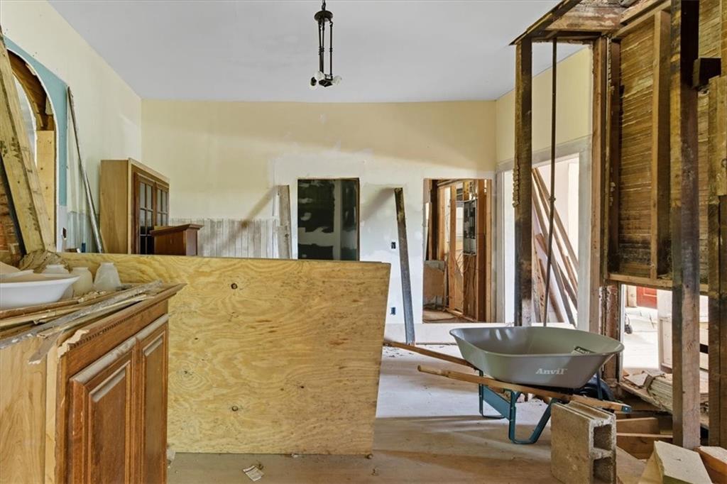111 Bryan Street West Bremen, GA 30110 - Photo 14 of 32 a living room with a table or couch and a fireplace
